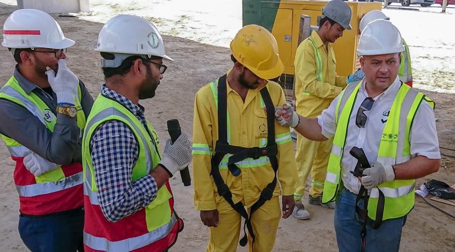 Jason Woods - IPAF India representative shows how to wear a harness