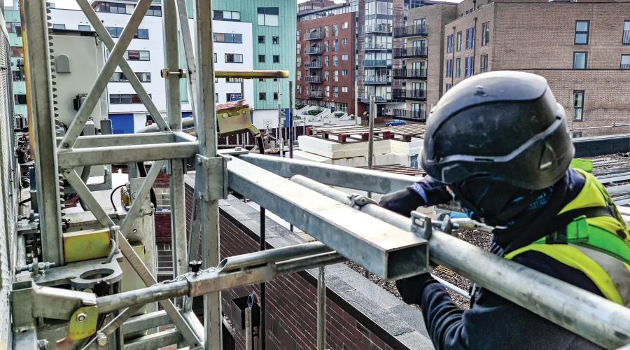 Hoist worker with black helmet
