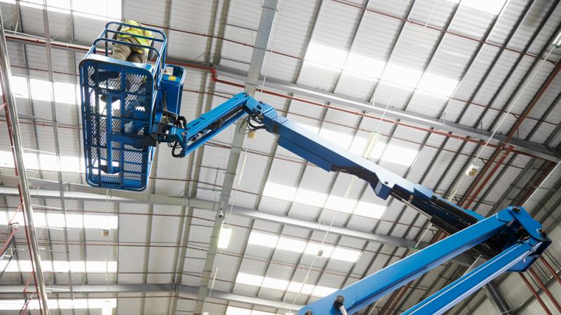 MEWP elevated in warehouse